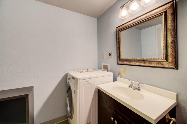 bathroom with washer / dryer and vanity