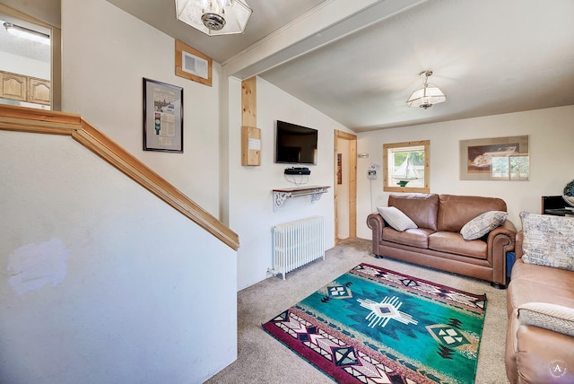 carpeted living area with visible vents, radiator heating unit, and vaulted ceiling