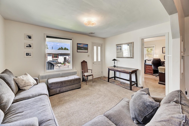 living area with light carpet