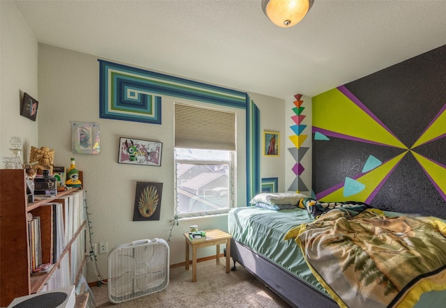 carpeted bedroom featuring baseboards