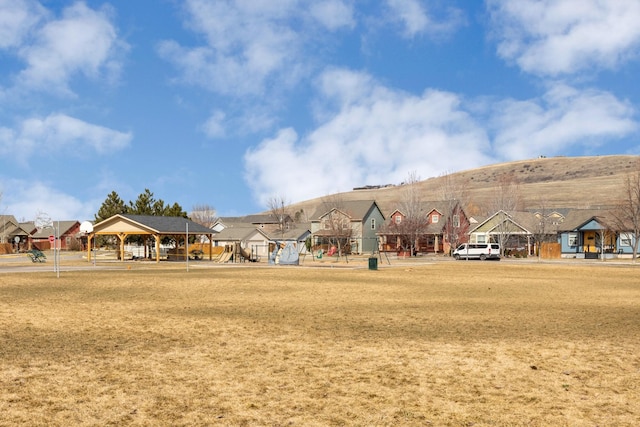 view of community featuring a gazebo, playground community, and a residential view