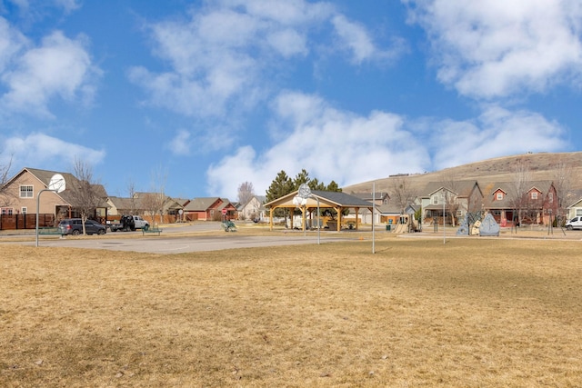 surrounding community with a gazebo and a residential view