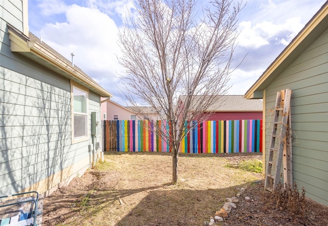 view of yard with fence