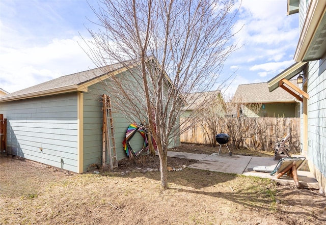 view of yard featuring a patio and fence