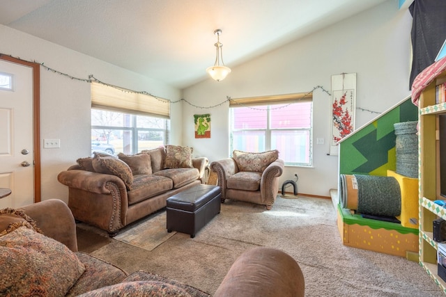 living room with lofted ceiling and carpet floors