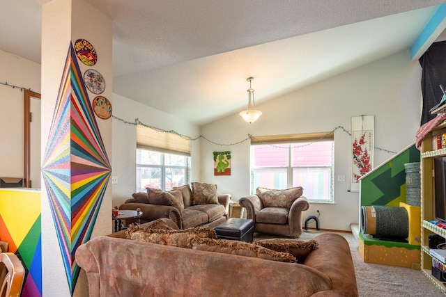 carpeted living area with vaulted ceiling