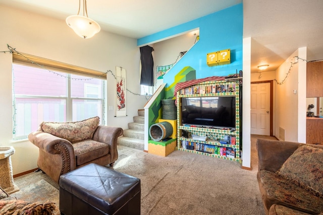 living room with visible vents, baseboards, carpet, and stairs