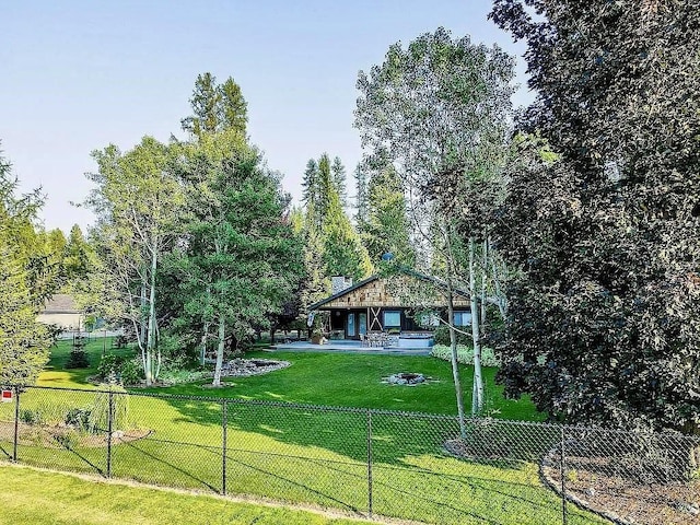 view of front of house with a front yard and fence