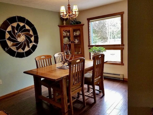 dining room featuring a chandelier, baseboard heating, baseboards, and dark wood-style flooring