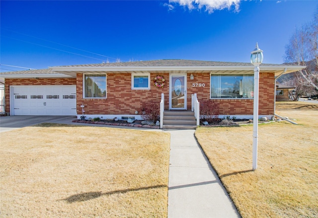 3790 Continental Dr, Butte, MT 59701 - ranch-style house featuring driveway, brick siding, a front lawn, a shingled roof, and a garage