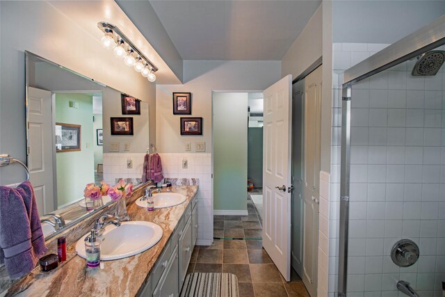 3790 Continental Dr, Butte, MT 59701 - full bathroom with double vanity, a sink, and tiled shower
