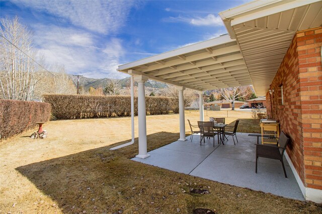 3790 Continental Dr, Butte, MT 59701 - view of patio / terrace with a mountain view and outdoor dining space