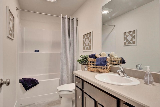 bathroom with vanity, toilet, wood finished floors, and shower / bath combo with shower curtain