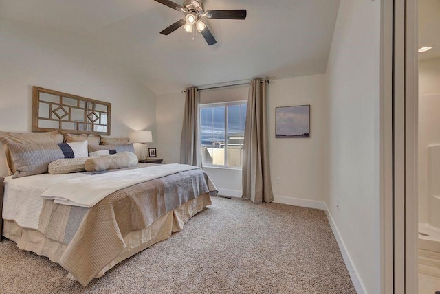 bedroom with baseboards, light colored carpet, a ceiling fan, and vaulted ceiling