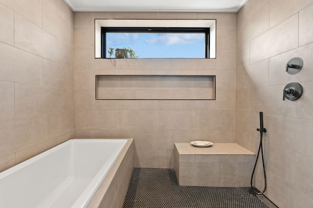 full bath featuring tiled tub and a tile shower