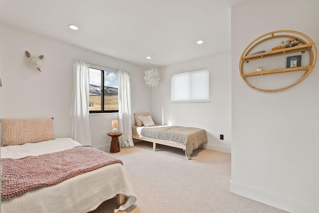 carpeted bedroom with recessed lighting and baseboards