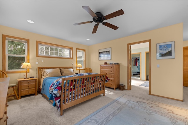 bedroom with a ceiling fan, recessed lighting, and light carpet