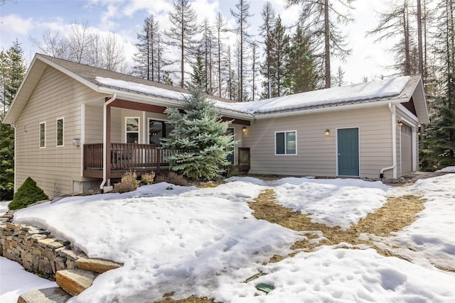 view of front of house featuring a porch and an attached garage