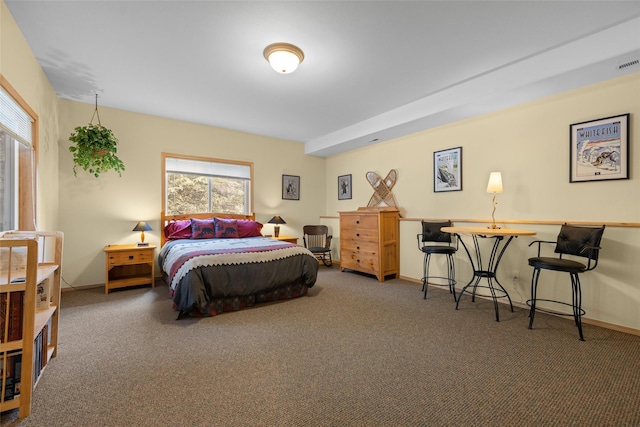 carpeted bedroom featuring visible vents and baseboards