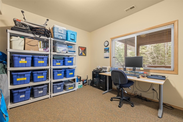 carpeted office space featuring baseboards and visible vents