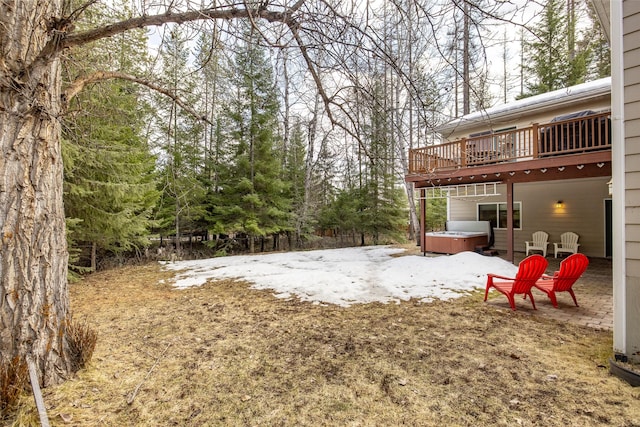 view of yard featuring a deck and a hot tub