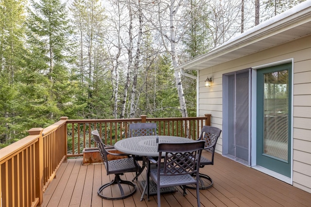 deck with outdoor dining area