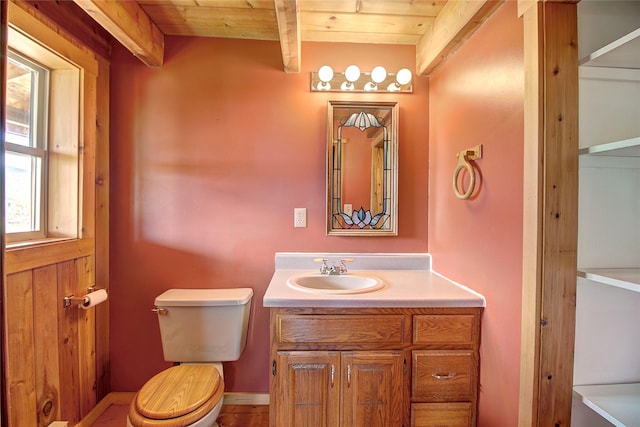 bathroom with vanity, beam ceiling, toilet, and wood ceiling