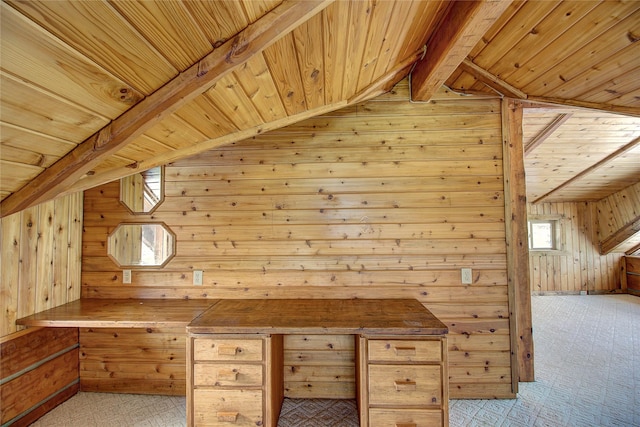 additional living space featuring wooden walls, vaulted ceiling with beams, wood ceiling, and light colored carpet