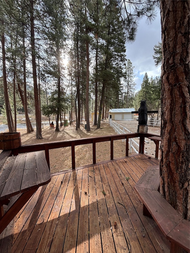 wooden deck with an outbuilding