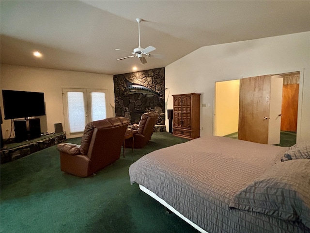 bedroom featuring carpet, ceiling fan, a fireplace, and vaulted ceiling