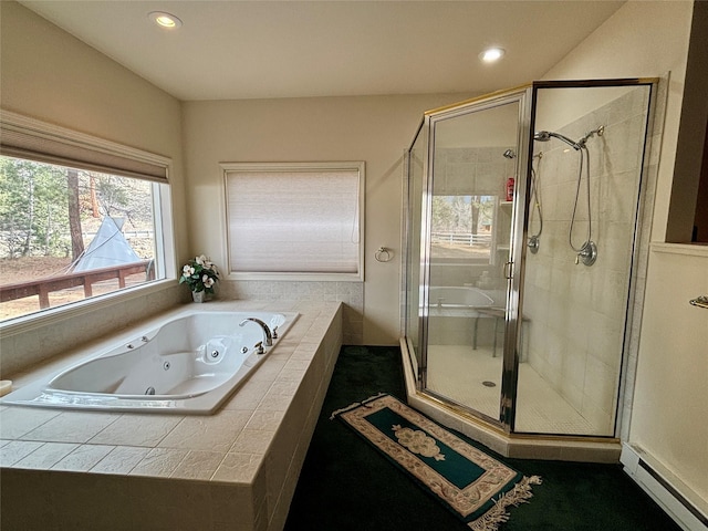 bathroom featuring recessed lighting, a baseboard radiator, a tub with jets, and a stall shower