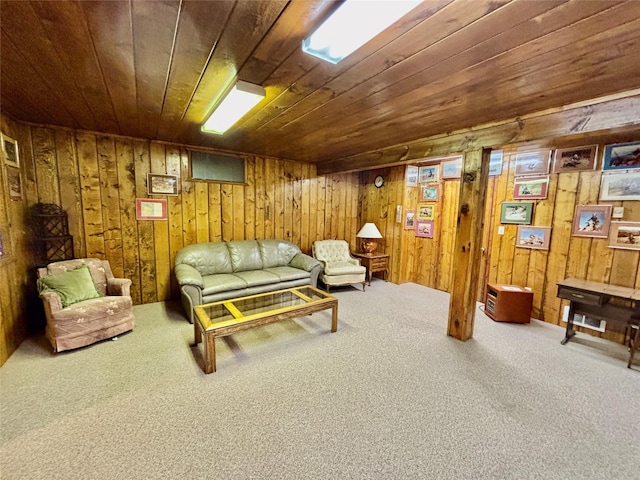 living room with carpet, wood ceiling, and wood walls