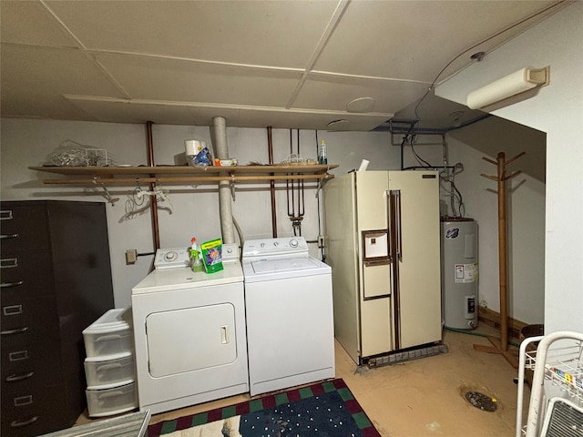 washroom featuring washing machine and clothes dryer and electric water heater