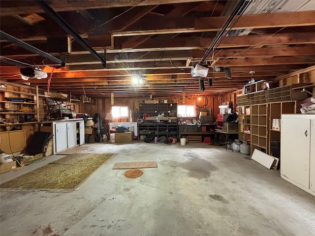 garage featuring a workshop area and a garage door opener