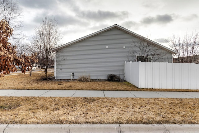 view of side of property with fence