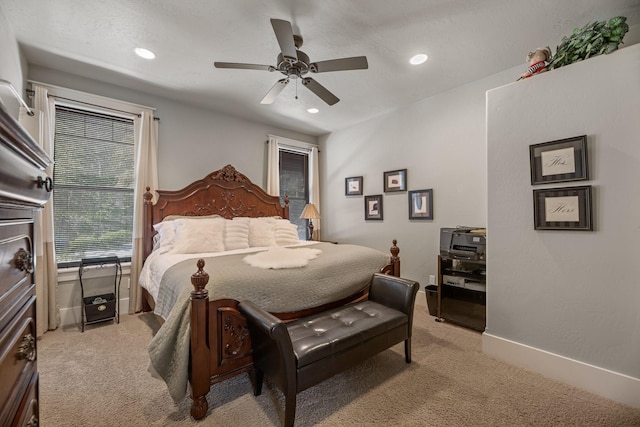 bedroom with ceiling fan, recessed lighting, baseboards, and light carpet