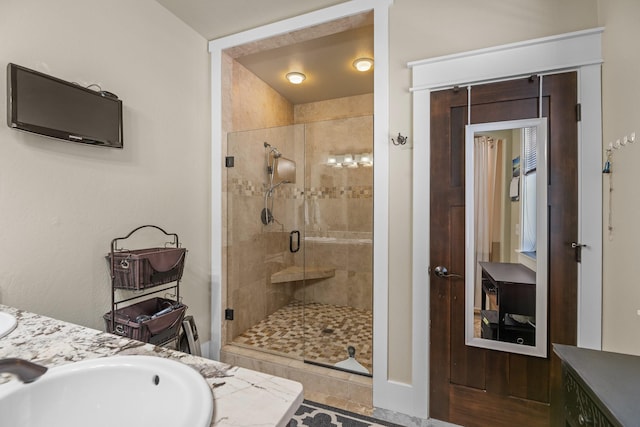 bathroom with vanity and a shower stall