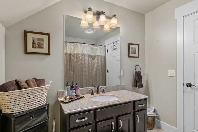 full bathroom featuring vanity and baseboards