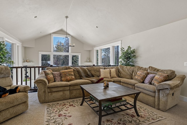 living area with a notable chandelier, light colored carpet, and high vaulted ceiling