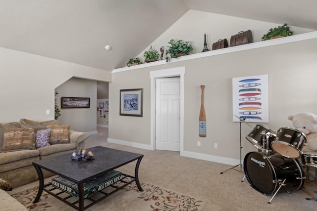 carpeted living room with baseboards and high vaulted ceiling