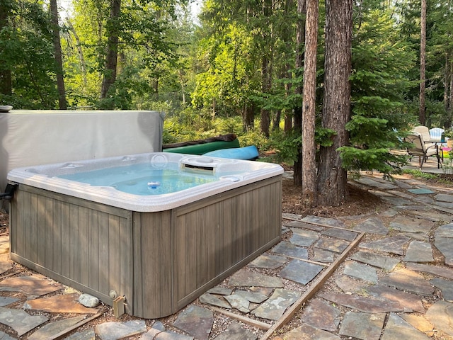 exterior space featuring a hot tub