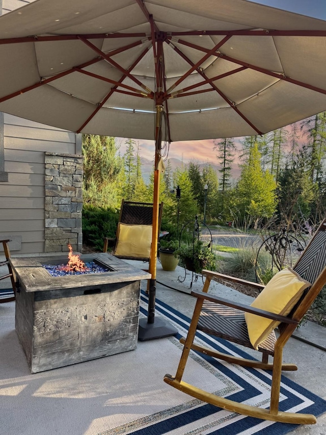 patio terrace at dusk with an outdoor fire pit