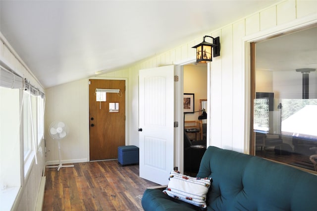 living room with dark wood-style floors and vaulted ceiling