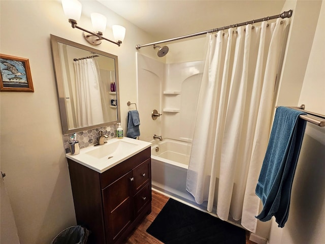 31611 Holmes Creek Ln, Polson, MT 59860 - full bath with vanity, shower / bath combo, decorative backsplash, and wood finished floors