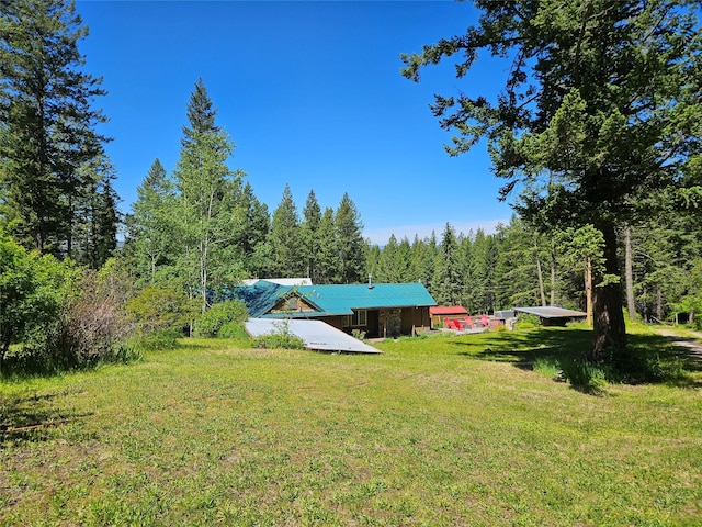 view of yard featuring a wooded view