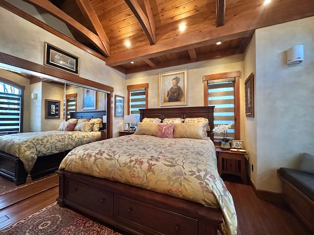 bedroom featuring dark wood finished floors, wood ceiling, lofted ceiling with beams, and baseboards