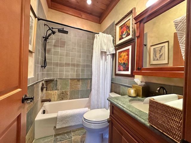 full bathroom featuring toilet, vanity, and shower / bathtub combination with curtain