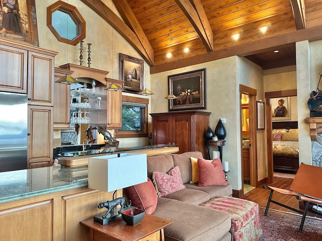 living area featuring beamed ceiling, wood finished floors, high vaulted ceiling, and wooden ceiling