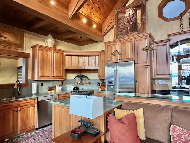 kitchen with beamed ceiling, decorative backsplash, appliances with stainless steel finishes, wooden ceiling, and a sink