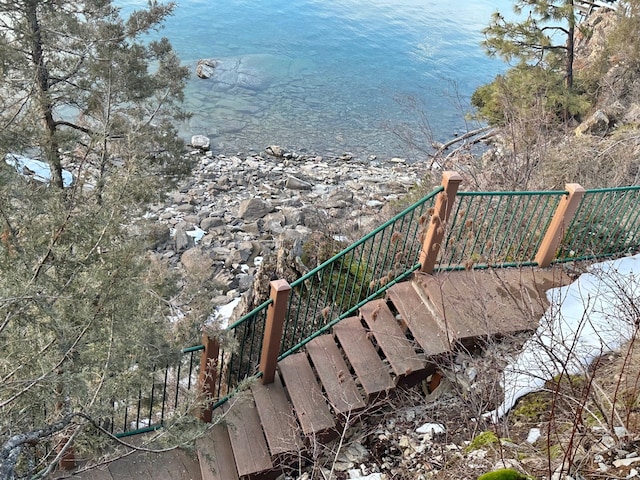 staircase featuring a water view